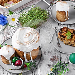 Easter cake with caramelized icing and other festive treats on the white table