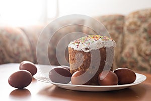 easter cake and red eggs on rustic wooden table. Top view.