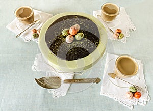 Easter cake with tea matcha decorated chocolate eggs