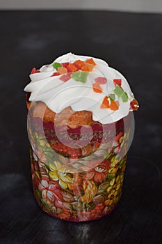 Easter cakes with candied fruit, icing and sprinkles, fresh, side view isolated