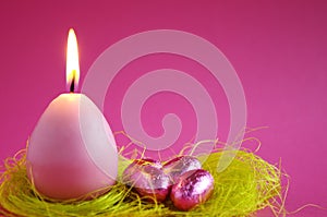 Easter candle with easter eggs