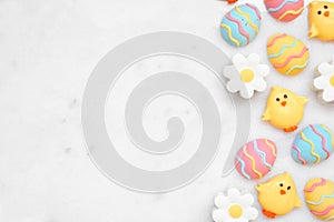 Easter candy side border against a white marble background