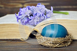 Easter card with blue Easter egg and hyacinth flower