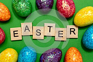 Easter card with eggs on a green background and the inscription Easter. Easter spring break concept