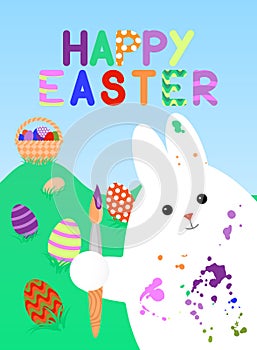 Easter card with white rabbit, smeared with paint brush in his paw. In the background lie grass colored eggs with patterns, there