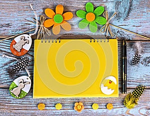 Easter card with yellow and green Easter eggs, decorative flowers, feathers on a wooden background.Generated image