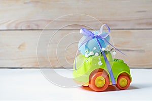 Easter cars with an egg on a white background