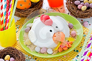 Easter chicken fondant cake on festive decorated table