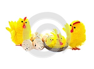 Easter chickens and eggs on white