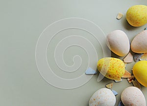 Easter chocolate eggs on beige plate. Different colors.