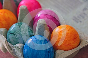 Easter colored eggs in a cardboard box