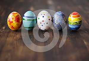 Easter colorful eggs on wooden background