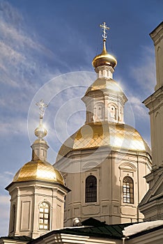 Easter is coming! Domes and crosses of the Kazan Cathedral of the Monastery Diveevo, Russia in the glare of the setting sun