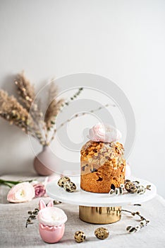 Easter composition with cake, eggs and flowers