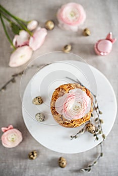 Easter composition with cake, eggs and flowers