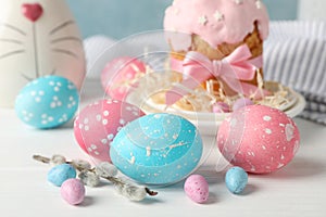 Easter composition with Easter cake and eggs on wooden table, closeup