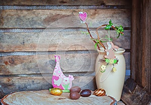 Easter composition of Easter eggs, a wriggle hazel with rabbit a