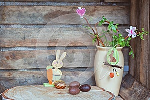 Easter composition of Easter eggs, a wriggle hazel with rabbit,