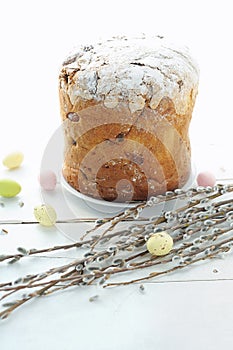 Easter composition with eggs holiday cake and willow branches