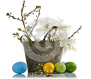 Easter composition with yellow flowers and eggs.