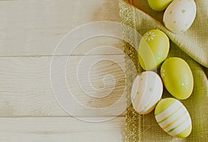 Easter concept with colored eggs on wooden background