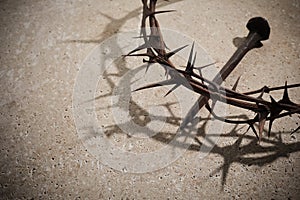 Easter concept. Crown of thorns with Nail on a stone background.