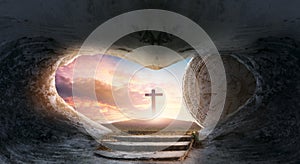 Easter concept: Empty Tomb Of Jesus Christ At Sunrise With  Cross background