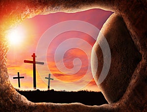 Easter Concept of Jesus Resurrection Showing Empty Tomb With Crucifixion At Sunrise