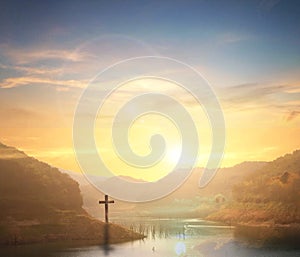 Easter concept:Silhouette cross on Calvary mountain sunset background.