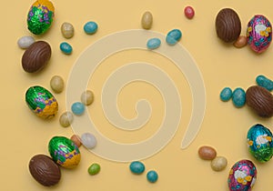 Easter concept.. Stylish Frame background with quail, gold and blue easter eggs with copy space for text. isolated on background.