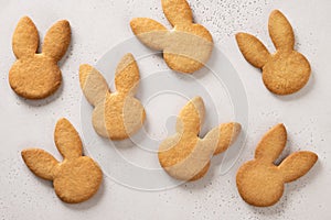 Easter cookies bunny shaped on white background. Festive food and kids snacks