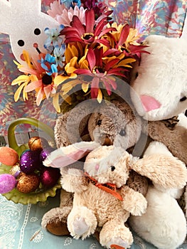 Easter cuddly bunnies, sparkly eggs, spring flowers,