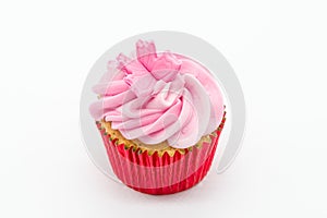 Easter cup cake with pink icing and red sponge casing on a white background