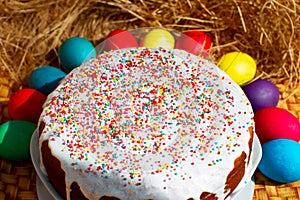 Easter cupcake or Russian Easter cake with beautiful colored decorative topping, Easter still life. Colored eggs