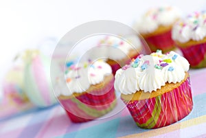 Easter Cupcakes with sprinkles and pastel colors