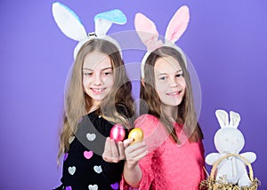 Easter day. Happy easter. Holiday bunny girls with long bunny ears. Egg and bunny holiday attribute. Sisters celebrate