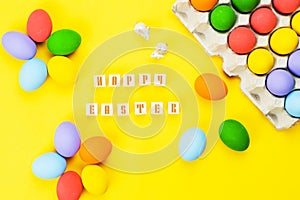 Easter day little Bunny rabbit with decorated eggs on yellow background