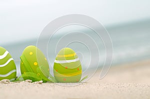 Easter decorated eggs on sand