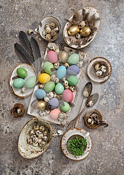 Easter decoration colored eggs birds feather. Boho style