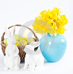 Easter decoration with daffodils, rabbits and eggs