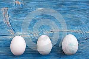 Easter decoration. Easter eggs on a blue wooden table background