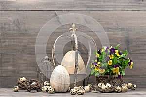 Easter decoration with eggs and pansy flowers