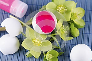 Easter decoration with eggs and red tempera paint on a blue pad