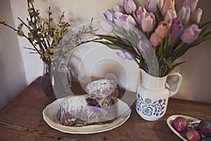 Easter decoration on table with Easter Lamb Sponge Cake and easter gingerbread, tulips and willow yew