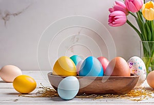 Easter decorations, colorfully painted and decorated Easter eggs and spring flowers on a wood background