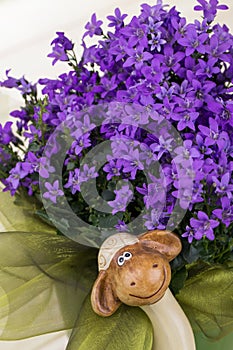Easter decorations with purple flowers,green chiffon and funny