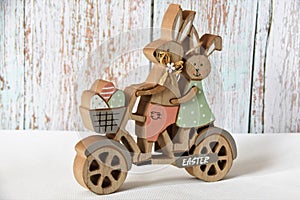 Easter decorations, two wooden rabbits a bike