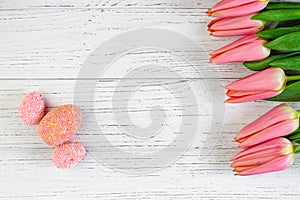 Easter decorative eggs with tulips on a white background from boards.