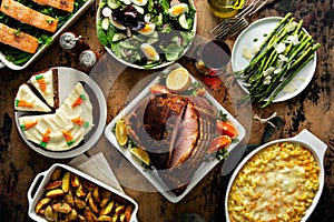 Easter dinner table with ham, asparagus and cake