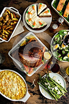 Easter dinner table with ham, asparagus and cake